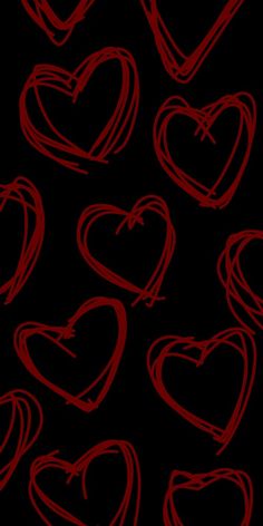 red hearts drawn on a black background