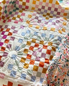 two quilts that are laying next to each other