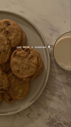 chocolate chip cookies on a plate next to a glass of milk with the words eat milk and cookies