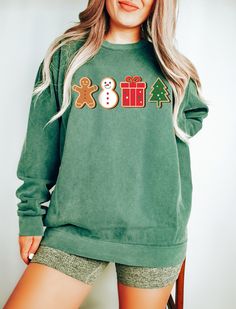 "Gingerbread Cookies Sweatshirt, Christmas Sweater, Xmas Shirt, Christmas Gift, Comfort Colors® Tee, Winter Sweatshirt, Holiday Sweater This fun design reflects the joy of the holiday season! \"Gingerbread Cookies Sweatshirt\" is filled with sweet and adorable gingerbread cookie figures. This sweatshirt is the perfect way to share the Christmas spirit and holiday cheer. An ideal choice to create smiles on everyone's faces and celebrate a time filled with sweetness. Complete your style with this sweatshirt for a sweet and cozy Christmas feel!  Hi! WELCOME TO DELUXSTOREUSA This sweatshirt perfect gift as a holiday apparel. Ideal for any situation, a unisex heavy blend crewneck sweatshirt is pure comfort  Washing Care Instructors Use cold water when washing, do not use bleach, do not dry clea Santa Sweatshirt, Cute Christmas Shirts, Coffee Sweatshirt, Holiday Apparel, Comfort Colors Sweatshirt, Christmas Lovers, Santa Shirts, Xmas Shirts, Holiday Sweatshirt