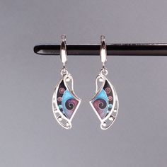 100% handmade sterling silver earrings, covered with hot cloisonné enamel. Cloisonné  is an ancient technique for decorating metalwork objects with colored material held in place or separated by metal strips or wire, normally of gold or silver. This process is quite laborious, because all the details require hand processing. Georgian cloisonné enamel counts more than 1200 years of history.  Our handmade pendants, earrings, brooches are vibrant with colour and compliment any outfit, prefered for Enamel Pendant Earrings For Gifts, Artistic Enamel Jewelry With Matching Earrings, Elegant Enamel Earrings With Artistic Design, Fusion Style Artistic Earrings For Gift, Artistic Enamel Jewelry With Earrings, Enamel Earrings With Artistic Design For Gift, Unique Enamel Pierced Earrings, Artistic Enamel Earrings For Gifts, Unique Enamel Earrings For Pierced Ears