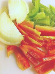 sliced up vegetables sitting on top of a white plate