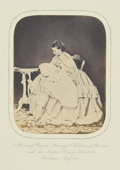 an old fashion photo of a woman sitting on a chair