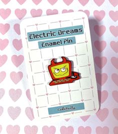 an electric dreams enamel pin on a pink and white background