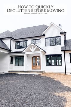 a large white house with black trim on the front and side windows that says how to quickly declutter before moving