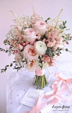 a bouquet of flowers is displayed on the instagram page, and it's pink