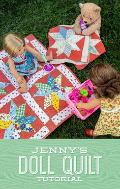 two dolls sitting on top of a red and white quilt next to a teddy bear