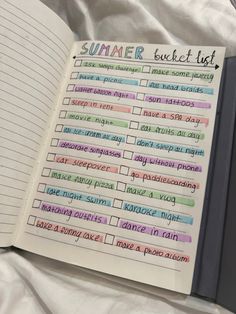 an open notebook with some writing on it and the words summer written in cursive