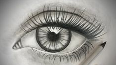 a pencil drawing of an eye with long lashes