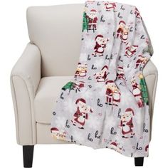 a white chair with a santa clause blanket on it