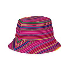 Inspired by the vibrant traditions of Peru, our Peruvian Reversible Bucket Hat brings the essence of South American culture to your style. Featuring a captivating Peruvian print, this hat showcases the rich colors and intricate patterns found in Peruvian textiles.This reversible bucket hat can be worn on both sides, making it easy to match with different outfits. Made of breathable premium fabric, this hat will become your go-to streetwear accessory. Pink Adjustable Bohemian Bucket Hat, Adjustable Pink Bohemian Bucket Hat, Bohemian Reversible Curved Brim Hat, Adjustable Multicolor Reversible Sun Hat, Bohemian Reversible Hat With Curved Brim, Bohemian Pink Bucket Hat, Pink Bohemian Bucket Hat For Festival, Traditional Multicolor Wide Brim Sun Hat, Traditional Multicolor Sun Hat With Curved Brim