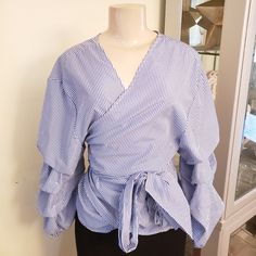 Be Stylish And Fabulous In This New Wrap Shirt With Puff Sleeves For The Summer. Gift For You, Partner, Or Mom Fyi: The Shirt Is True To Size, Even Though It Is On A Small Mannequin. I Clamped The Extra Fabric In The Back. Size: 1x Blue Blouse With Balloon Sleeves For Work, Blue Puff Sleeve Shirt For Spring, Trendy Blue Top With Balloon Sleeves, Trendy Blue Balloon Sleeve Tops, Small Mannequin, Wrap Shirt, Summer Gift, Extra Fabric, Puff Sleeves