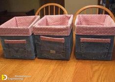 three baskets sitting on top of a wooden table