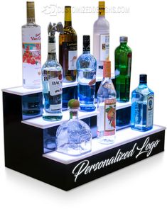 an assortment of alcohol bottles are displayed on a shelf