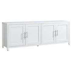 a white sideboard with three doors and two drawers on each side, in front of a white background