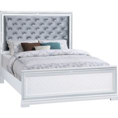 a white bed with an upholstered headboard and foot board on the side