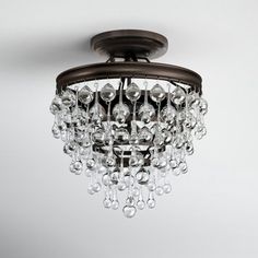 a chandelier hanging from the ceiling in a room