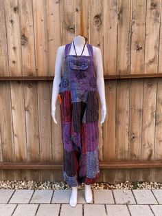 100%  Nepali cotton overalls!  The perfect pair of comfy, each to wear hippie overalls. Unisex  Has front, side, and back pockets.  Simple design, loose fit and lightweight.  Harem pant style. (Drop crotch / MC Hammer)  Arm lengths have 3 adjustable button sizes to shorten or length top.  Great summer staple piece for casual and boho feel. Colors are beautiful and vibrant  Easy to wear  Nice thickness to the overall and not see through Multiple Sizes  S/M and M/L  100% Cotton  Made in Nepal 🇳🇵 Bohemian Cotton Jumpsuits And Rompers With Relaxed Fit, Bohemian Overalls With Pockets For Festivals, Casual Cotton Overalls For Festivals, Bohemian Style Overalls For Festival, Bohemian Cotton Overalls, Bohemian Sleeveless Overalls With Pockets, Cotton Hippie Style Overalls, Cotton Patchwork Overalls Jumpsuit, Cotton Patchwork Overalls Jumpsuits And Rompers