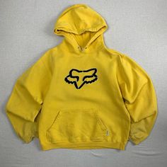 Vintage Yellow Fox Racing Hoodie Sweater - S -Y2K Fair condition, Great distressing specifically along sleeve openings see 5th and 6th photos, discoloration along shoulders body and hood of sweater. Small holes on both sides of pocket. Small pinhole on sleeve Missing draw strings. No major structural damage. Seams are in great shape. Embroidered Logo. Made in China. 80% cotton 20% polyester. Measurements     Length(shoulder-hem): 22 Chest(armpit-armpit): 21 Hem: 17 Neck: 9 Sleeves:  23 Shoulders Retro Yellow Sweatshirt For Streetwear, Cute Fox Hoodies, Yellow Streetwear Sweatshirt, Fox Racing Hoodie, Fox Hoodie, Fox Racing, Vintage Yellow, Sweater Hoodie, Pullover Hoodie