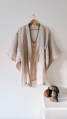 The 'Mala' Kimono  - is a one off a,  kind handmade kimono, created in delicate gentle woven linen, slightly transparentand perfectly suited for hot summer evenings.  If you are a lover of the finer things in life, then this one-off lustworthy piece of art could be the jewel of your wardrobe. A deliciously decadent robe dedicated for the dreamers and gypsies.  100% Linen - one size fits AU6 - AU12 -  is a short kimono just covers to the beginning of the thigh, below the buttock area If you aren't sure of the size, send me your measurements. Kimono hand made in Australia One of a kind creation Elegant Linen Kimono For Summer, Elegant Linen Summer Kimono, Linen Wrap Kimono For Vacation, Handmade Long Sleeve Kimono For Summer, Spring Beach Kimono With Natural Dye, Handmade Long Sleeve Summer Kimono, Vacation Linen Wrap Kimono, Beige Linen Kimono For Beach, Beige Linen Beach Kimono