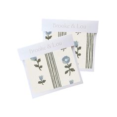 two cards with blue flowers on them and the words brooke & lou written in white