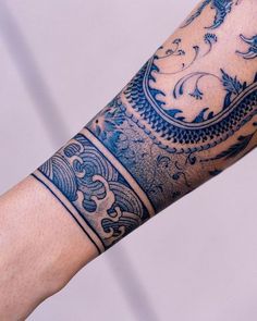 a person with a tattoo on their arm