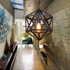 a light fixture hanging from the ceiling in a hallway