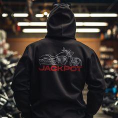 Hoodies for Victory Jackpot Motorcycle Riders Stay warm while riding your motorcycle with this high-quality Victory Jackpot hooded pullover designed to be the perfect source of warmth and comfort during your motorcycle journeys. This hoodie serves as the ultimate homage to these legendary motorcycles that have stolen the hearts of riders worldwide. Crafted with a three-panel fleece lining, this pullover hoodie ensures durability as you ride. Double stitched for added strength, it offers ample room for your riding movements. You can also find t-shirts with this same design in our shop. Whether you're a dedicated enthusiast of this bike or simply a lover of motorcycles, this hoodie is an excellent way to express your affection for these iconic bikes. With a variety of sizes to choose from, i Biker Style Long Sleeve Hooded Jacket For Outdoor, Biker Style Hooded Jacket With Long Sleeves For Outdoor, Biker Style Long Sleeve Hoodie For Streetwear, Biker Style Hoodie For Streetwear, Outdoor Long Sleeve Biker Hooded Jacket, Black Biker Hoodie For Streetwear, Winter Biker Hoodie, Black Biker Style Hoodie, Black Biker Style Streetwear Hoodie