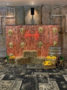 hay bales are stacked on top of each other in front of a backdrop