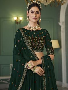 Buy redefined green georgette embroidered lehenga choli for celebrating upcoming festival celebrations. Shop this outstanding lehenga choli which comes with a Georgette blouse and Georgette dupatta. Green Lehenga With Unstitched Blouse For Navratri, Green Cutdana Choli For Navratri, Green Sets With Zari Work In Georgette, Green Georgette Set With Zari Work, Green Semi-stitched Anarkali Set With Unstitched Blouse, Designer Green Lehenga With Unstitched Blouse, Green Semi-stitched Choli With Cutdana Details, Green Semi-stitched Choli With Cutdana, Green Floor-length Choli With Resham Embroidery