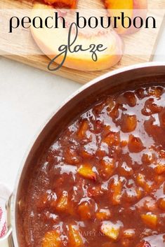 peach bourbon glaze in a pot with sliced peaches on the side and text overlay that reads peach bourbon glaze