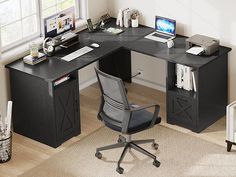 an office desk with a chair and computer on it