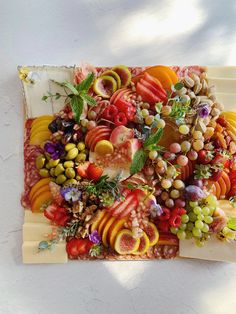 an art work made out of fruits and vegetables