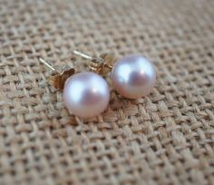 This is the perfect option for those who like cool, unique jewelry and the luxury, shine of gold and pearls. This earrings are well made, cute and/or elegant in design, and very desirable. The earrings are decorated with natural pearls. The pearls have light pink color. The earrings are studs. The clasp is in good working condition. ♥ Age/era: Circa 1970s - 1980s. ♥ The earrings have a hallmark. It is 14K. ♥ The earrings are about 7 mm in diameter. ��♥ The weight is 1.5 g. Every one interested in Mother Fashion, Gold And Pearls, Child Baby, Light Pink Color, Pink Pearl, Natural Pearls, Fashion Earrings, Solid Gold, Light Pink