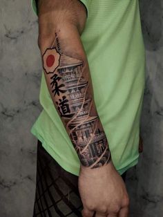 a man with a tattoo on his arm