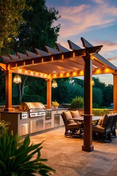 Outdoor kitchen with a grill, seating area, and pergola lit up at sunset. Outdoor Kitchen Layout, Cooking Outdoors