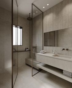 a large bathroom with two sinks and mirrors