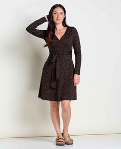 Dress up or down, no comfort sacrificed. A faux wrap is cute as can be but will stay secure, and a self-tie adds a bonus dose of pizzazz. Fall Wrap Dress With Tie Waist And Surplice Neckline, Fall Wrap Dress With Surplice Neckline And Tie Waist, Black Wrap Dress With Surplice Neckline For Fall, Black Wrap Dress For Fall, Long Sleeve Dress Black, Tencel Dress, Resale Shops, Black Long Sleeve Dress, Black Dots