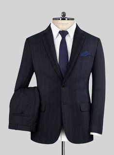 Our Reda Cashmere Blue Chalkstripe Wool Suit goes beyond mere clothing; it signifies refined taste, a dedication to excellence, and an embrace of timeless style. Meticulous crafted from Super 130's wool, it features a distinctive blue hue that radiates enduring class, while its subtle chalkstripe pattern adds a touch of understated flair. Whether you're advancing in your career or aiming to leave a lasting impression at an event, this suit stands as your unwavering companion, bestowing upon you an aura of glamour and sophistication.  Look Includes   Reda Cashmere Blue Chalkstripe Wool Fabric  Two Button Jacket Style  Notch Lapel  Horn Royal Black Buttons  Single Vent  Three Cuff Buttons  Two Welted Back Pockets on Trousers   Click 'Customize Now' to modify the look if needed.  
 
Lining: V Elegant Striped Suits For Semi-formal Occasions, Elegant Tailored Striped Suits, Striped Suits For Formal Occasions, Striped Suits In Suiting Fabric For Formal Occasions, Elegant Striped Suits For Business Casual, Striped Semi-formal Suit, Elegant Striped Suit With Notch Lapel, Elegant Striped Single Breasted Suit, Elegant Striped Single-breasted Suit