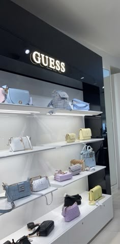 there are many purses on display in the store