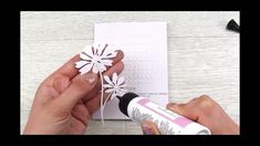 someone is making a paper flower with glue