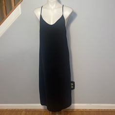 See You Monday Ladies Large Black Slip Midi Dress. Slits On Both Sides. 100% Polyester. Pull On Style. Pit To Pit 18 Inches Shoulder To Hemline 46 Inches Black V-neck Midi Dress With Side Slits, Casual Long Midi Dress For Evening, Knee-length Maxi Dress With Side Slits For Date Night, Knee-length Black Slip Dress For Date Night, Black Knee-length Slip Dress For Date Night, Black Longline Midi Dress For Party, Casual Long Midi Dress With Side Slits, Black Longline Dress For Date Night, Sleeveless Slip Dress With Side Slits For Date Night