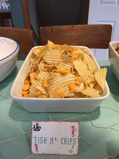 fish n'chips in a bowl on a table