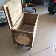 an open wooden box sitting on top of a floor