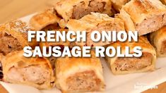 there are sausage rolls on the plate with words overlay that says french onion sausage rolls