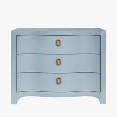 a blue chest of drawers with two gold handles