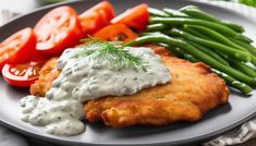 a plate topped with fried chicken, green beans and tomatoes