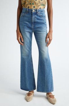 A high waist and flared legs enhance the cool '70s-inspired vibes of these nonstretch-denim jeans that will be your go-to staple in any season. 31" inseam; 22" leg opening; 13" front rise; 15" back rise (size 29) Zip fly with button closure Five-pocket style 80% cotton, 20% recycled cotton Machine wash, tumble dry Made in the USA Mid-rise Indigo Flare Jeans, Mid-rise Denim Wide Leg Pants With Belt Loops, Denim Blue Pull-on Wide Leg Bottoms, Bohemian Blue Wide-leg Flare Jeans, Ulla Johnson | Fall Winter 2022/2023, 70s Inspired, Ulla Johnson, Jeans Pants, Recycled Cotton