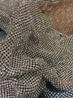 the fabric is covered in many different types of sequins