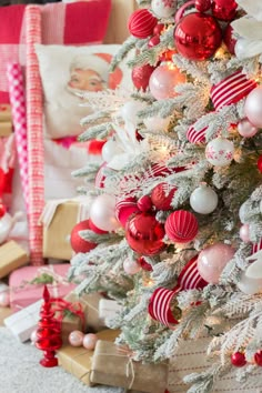 a christmas tree with red and white ornaments